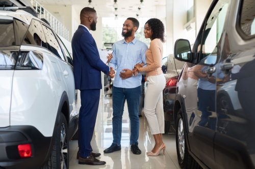 car-purchase-happy-customers-couple-handshaking-w-2022-12-16-07-13-40-utc (1) (1)