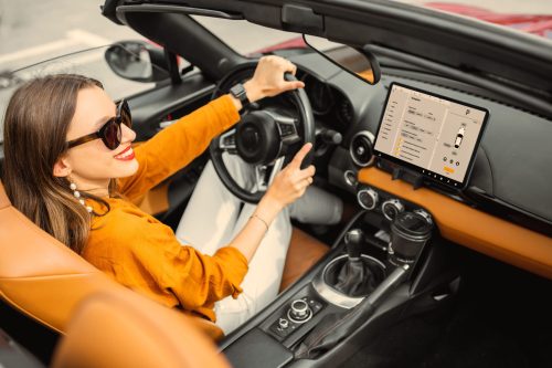 woman-driving-sports-car-with-a-digital-touchscree-2021-09-02-02-11-52-utc (1)